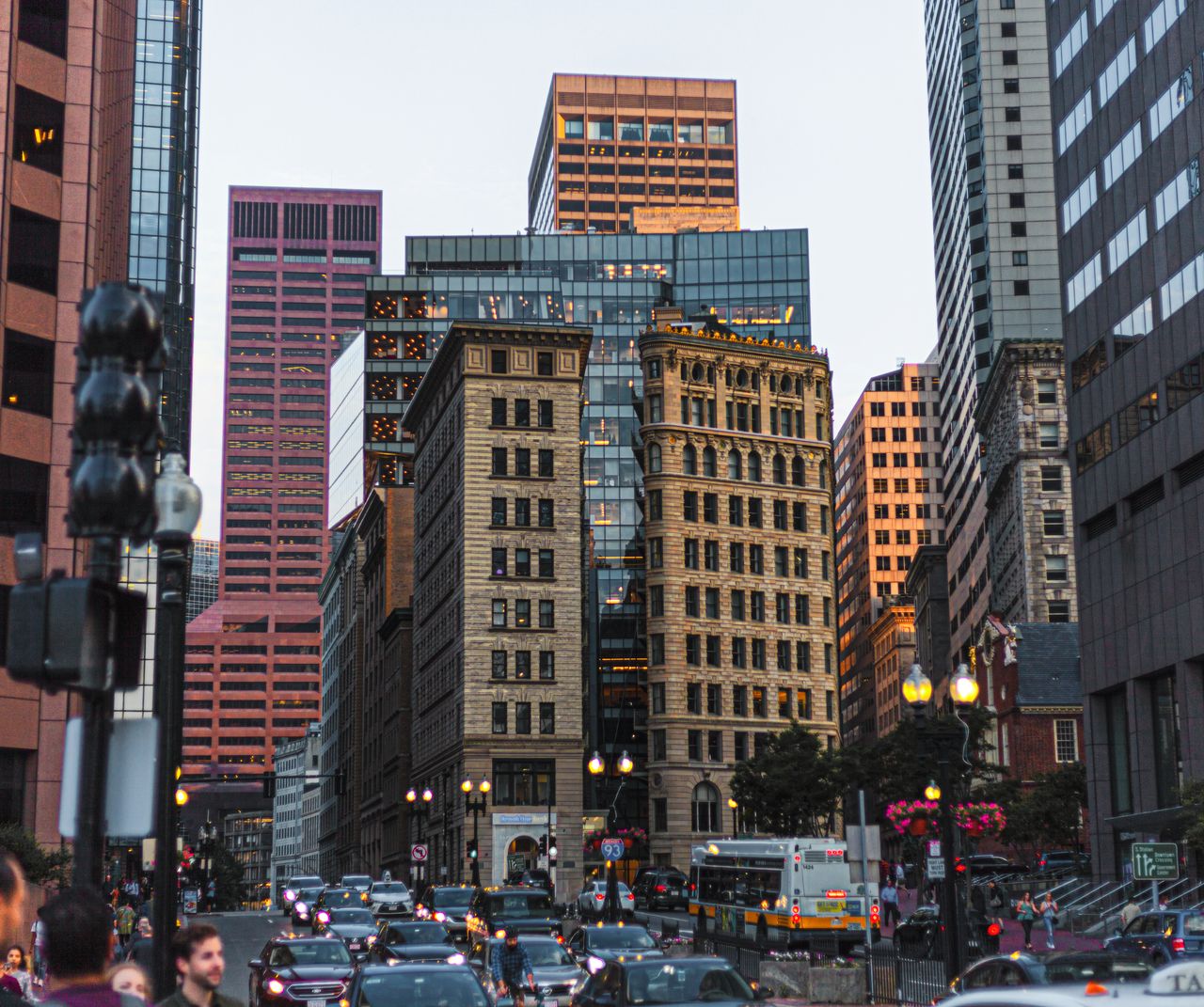 Bustling street scene in downtown Boston, showcasing modern and classic architecture.