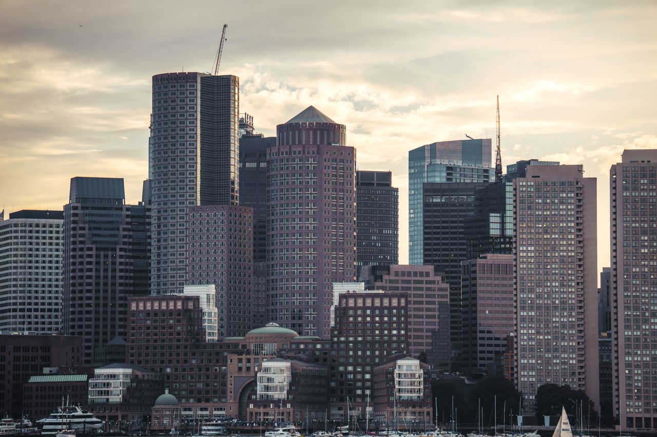 Captivating view of Boston's skyline at dusk featuring prominent skyscrapers and waterfront.